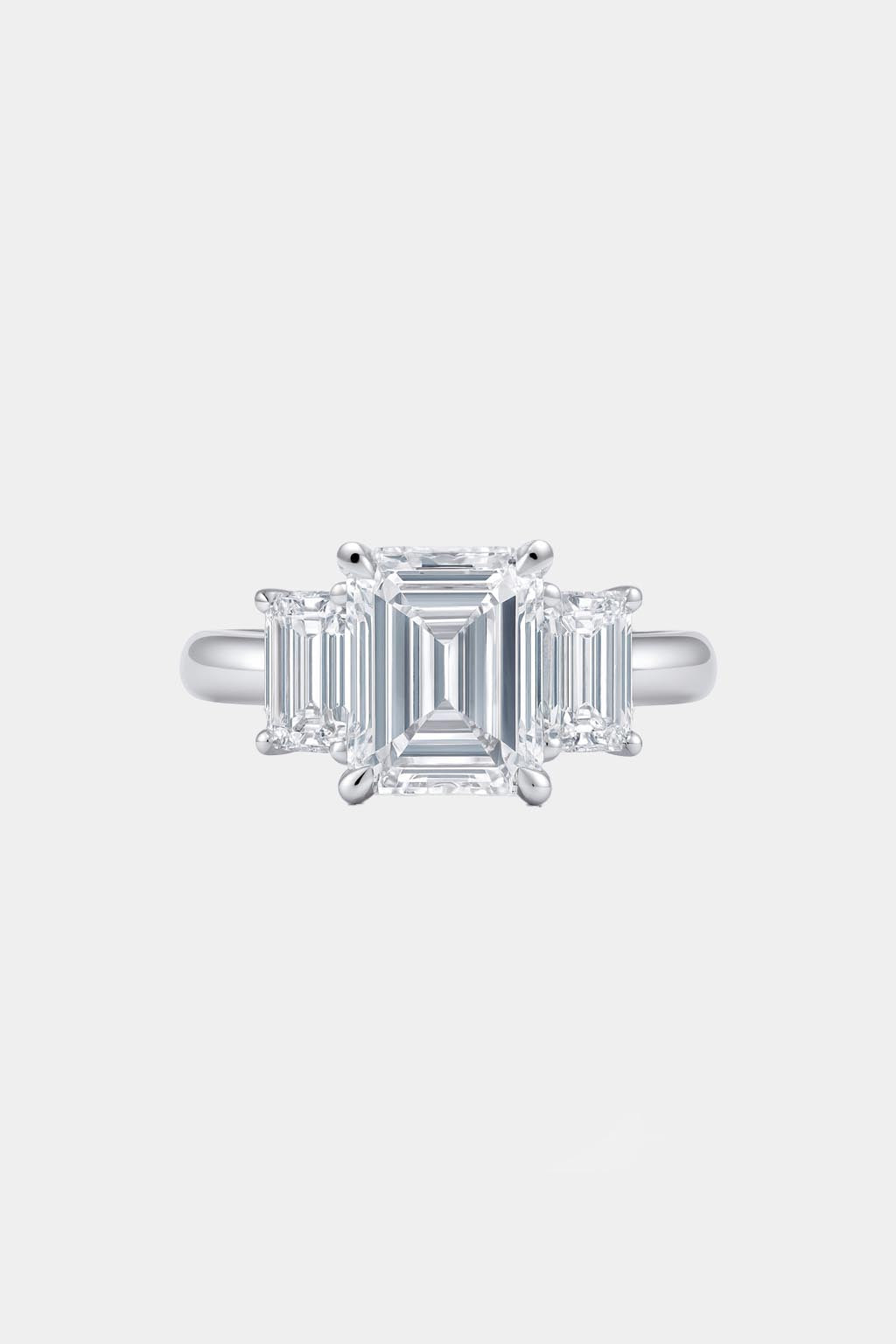 vivara – emerald cut three-stone engagement ring setting in yellow gold ag & co jewellery