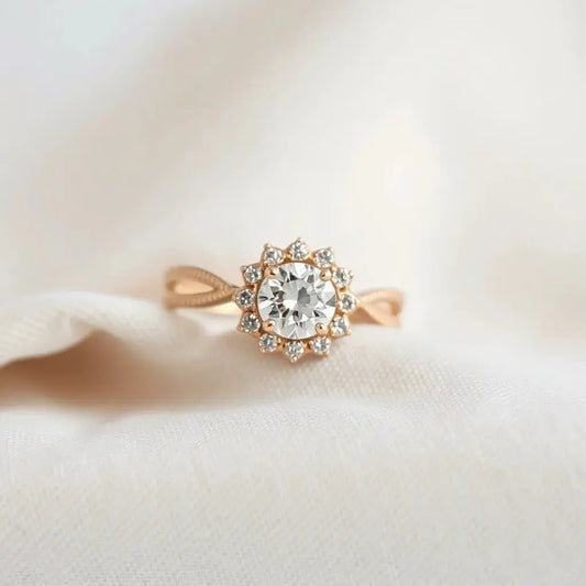 Halo engagement ring with a central round diamond surrounded by a sparkling halo on a neutral background