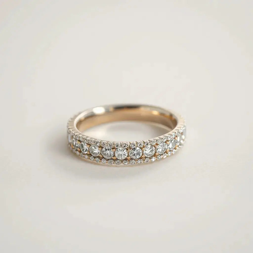 Close-up of a pavé diamond ring setting with small stones on a metal band