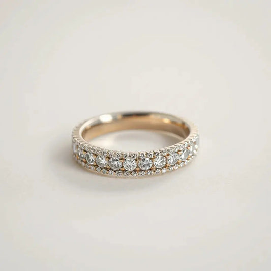 Close-up of a pavé diamond ring setting with small stones on a metal band