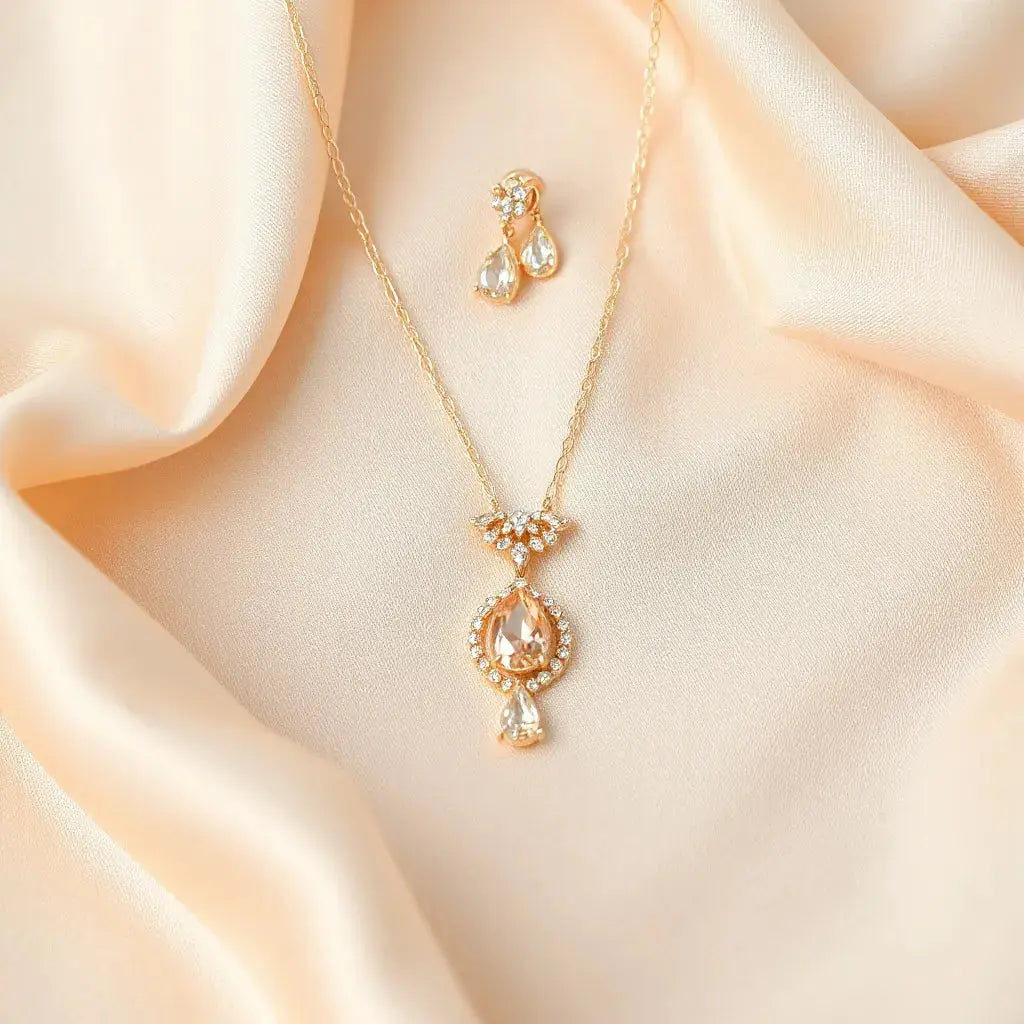 Matching bridal necklace, bracelet, and earrings resting on satin with subtle gemstone sparkle