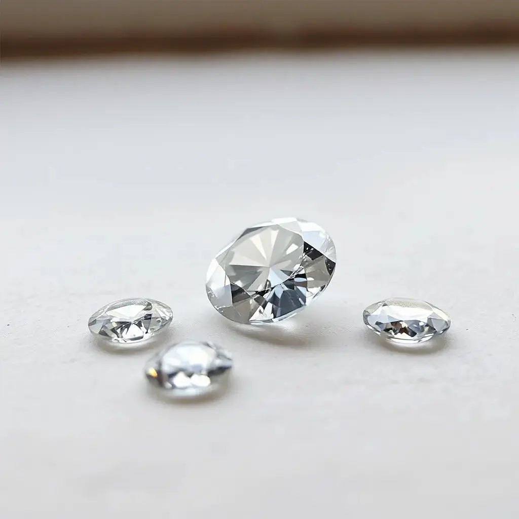 Loose lab grown diamonds arranged with soft sparkle on a neutral background