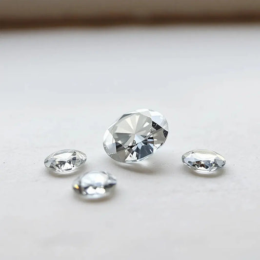 Loose lab grown diamonds arranged with soft sparkle on a neutral background