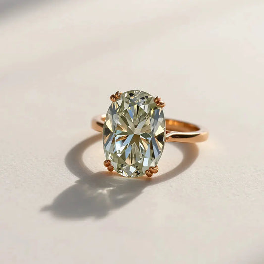 Oval diamond with Portuguese cut facets in a minimal ring setting on a soft neutral background