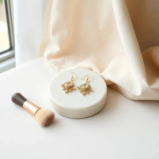 Elegant earrings arranged on a neutral surface with soft natural light