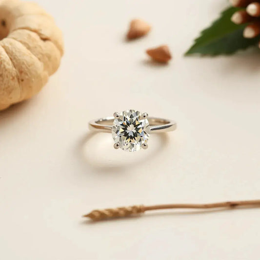 Oval diamond ring with a slender band, shown in soft studio light on a neutral background