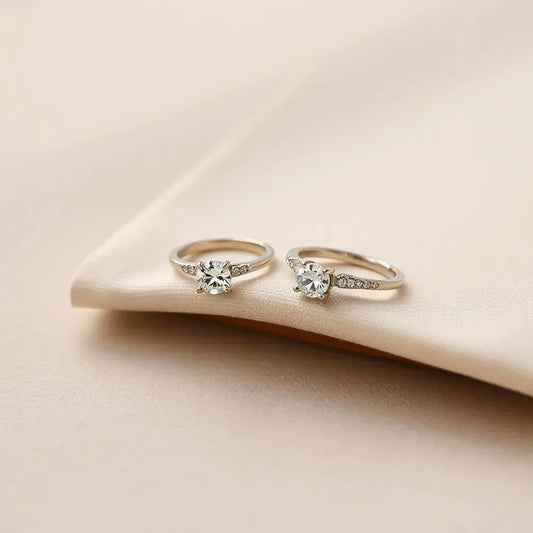 Unique diamond rings displayed on a neutral surface with soft natural light and subtle fabric accents.