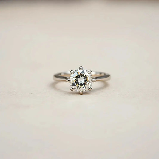 Engagement ring with a distinctive diamond setting on a neutral background with soft studio lighting