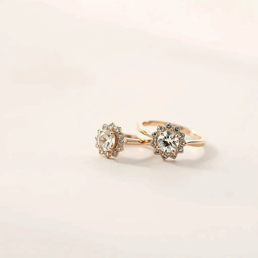 Elegant halo ring with a central stone and a delicate halo sparkle on a light neutral background