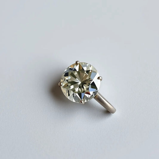 Portuguese cut natural diamond with crisp facets and soft studio lighting on a neutral background