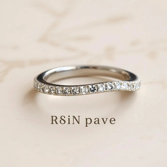 Close-up of a pavé diamond ring band showing densely set stones and light-catching facets