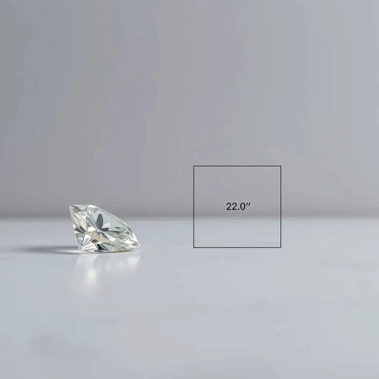 Faceted diamond and clean ratio diagram on a neutral workbench surface