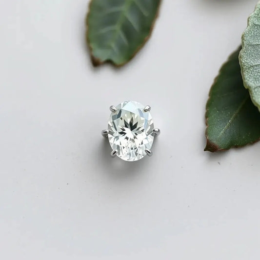 Oval lab-grown diamond with visible facets on a clean jewelry background with soft studio lighting