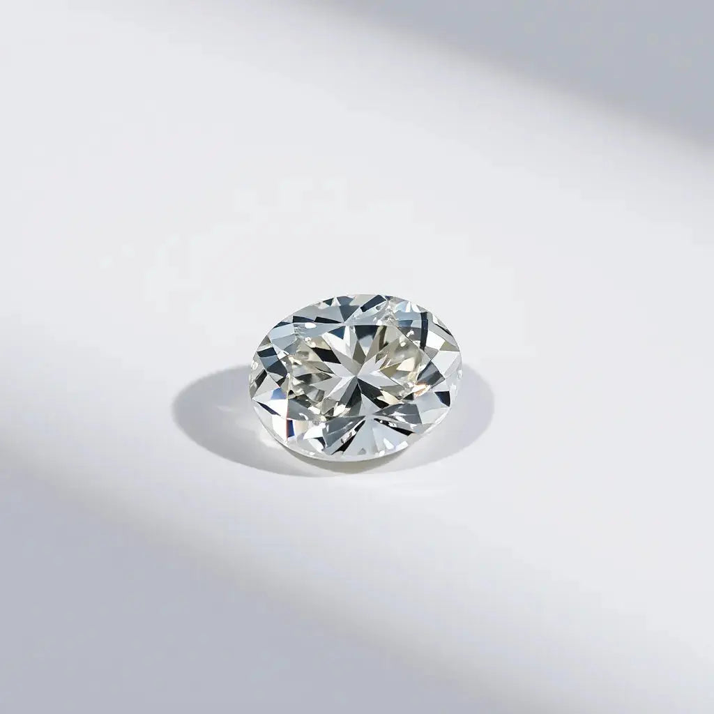 Oval Portuguese cut diamond with crisp facets and bright sparkle on a neutral background