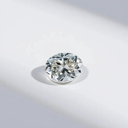 Oval Portuguese cut diamond with crisp facets and bright sparkle on a neutral background