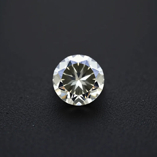 F color diamond with soft sparkle on a minimalist metal band against a dark neutral background