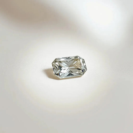Elongated cushion gemstone with 1.45 ratio proportions shown in soft studio light