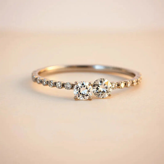 Diamond jewelry with sharp facets sparkling under warm studio light on a neutral background