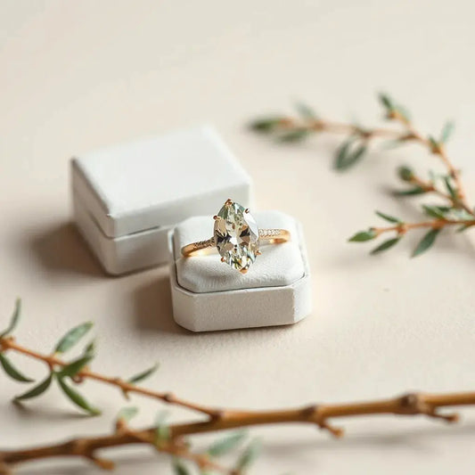 Lab grown moval engagement ring with faceted gemstone in a minimalist setting on a neutral background