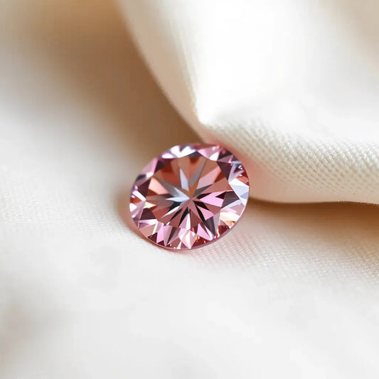 Pink Portuguese cut diamond gemstone with clear facets and soft pink sparkle on a neutral background