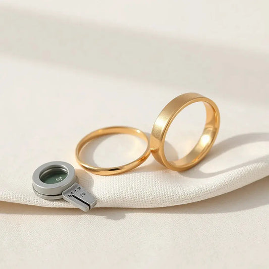 Comfort-fit engagement bands with smooth inside curves and soft reflections on neutral fabric