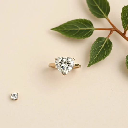 Heart-shaped diamond ring with a halo setting on a soft neutral background