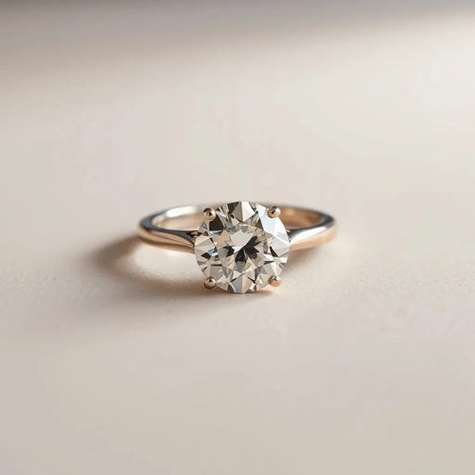 Diamond ring with prong setting under angled studio lighting showing enhanced sparkle