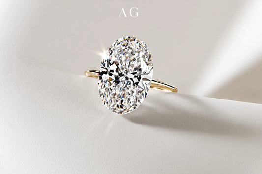 Oval Portuguese-cut diamond with crisp facets and soft studio reflections on a neutral background.