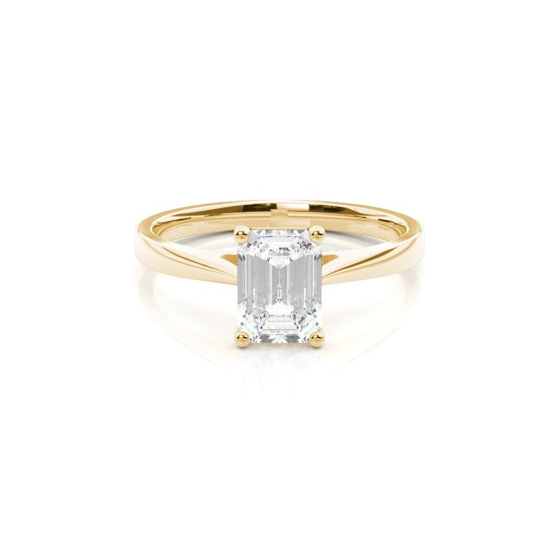 emerald cut moissanite solitaire diamond ring set in solid 14k yellow gold