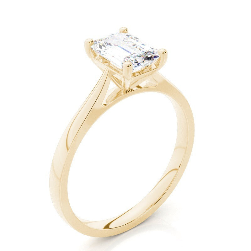 emerald cut moissanite solitaire diamond ring set in solid 14k yellow gold