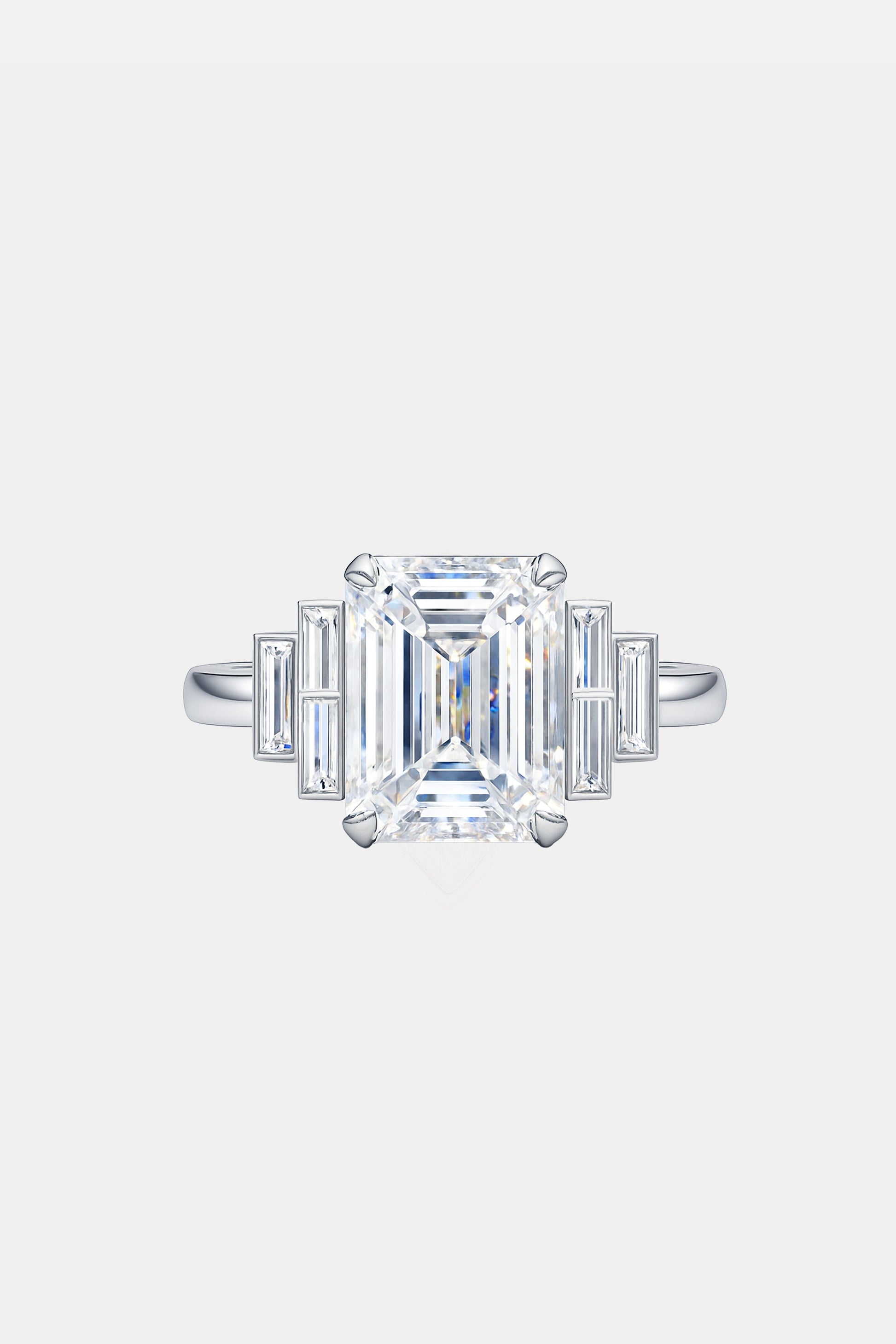 MARGAUX – Emerald Cut Ring with Graduated Baguette Side Stones in Platinum AG & CO Jewellery