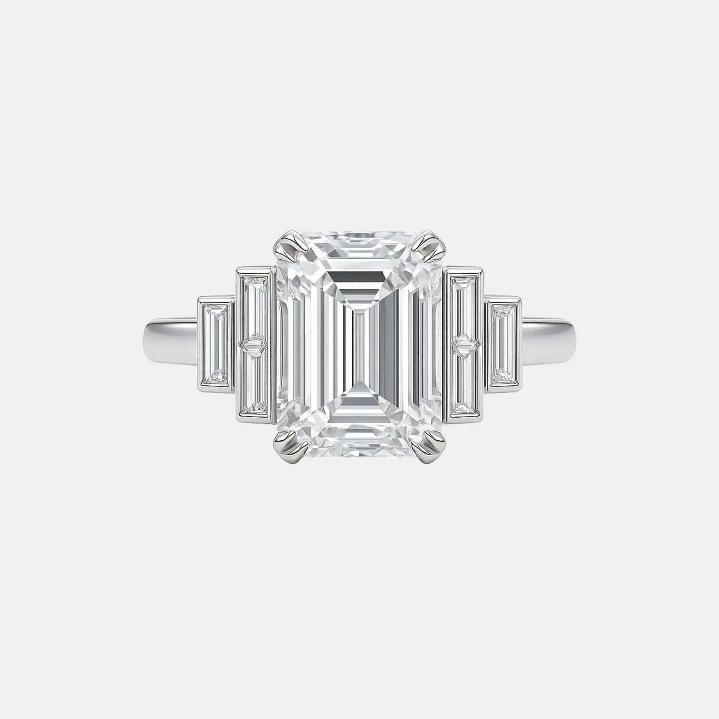 ashira- 5.50ct bezel set 7-stone lab diamond ring with emerald centre stone & baguette side stones ag & co jewellery