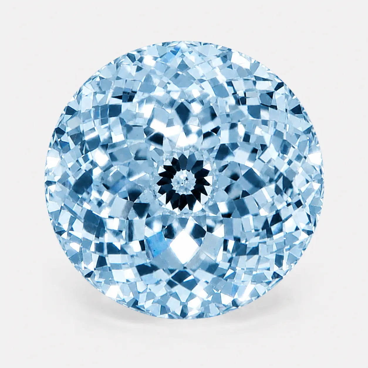 round portuguese diamond in a light blue tone