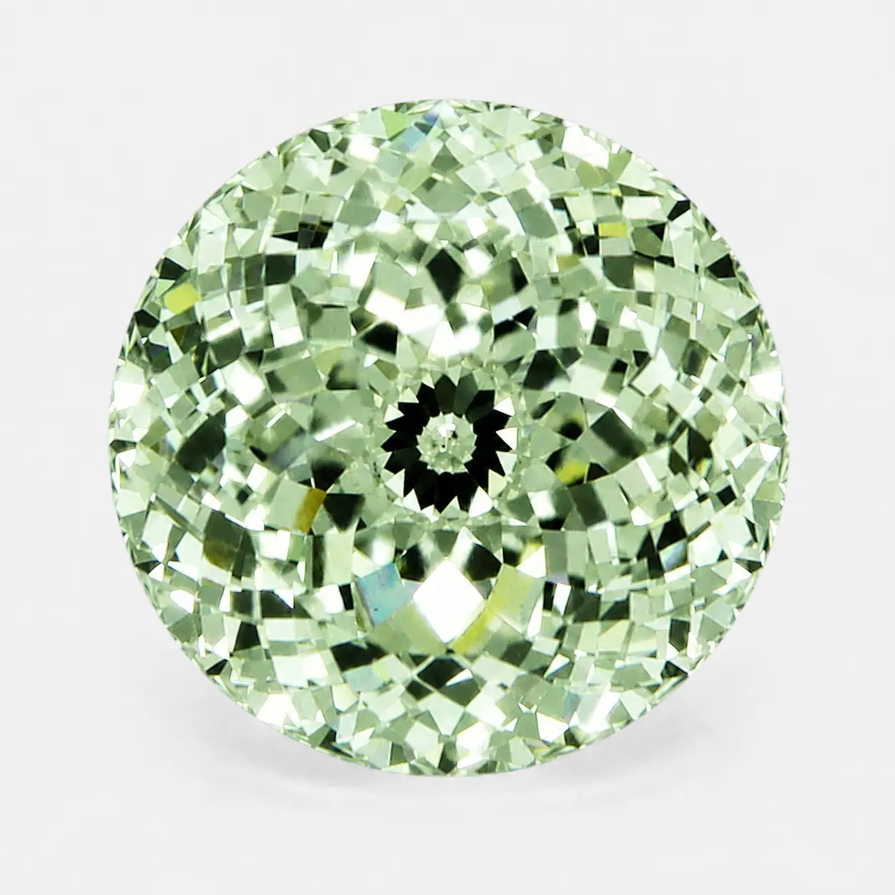 round portuguese diamond in a soft green tone