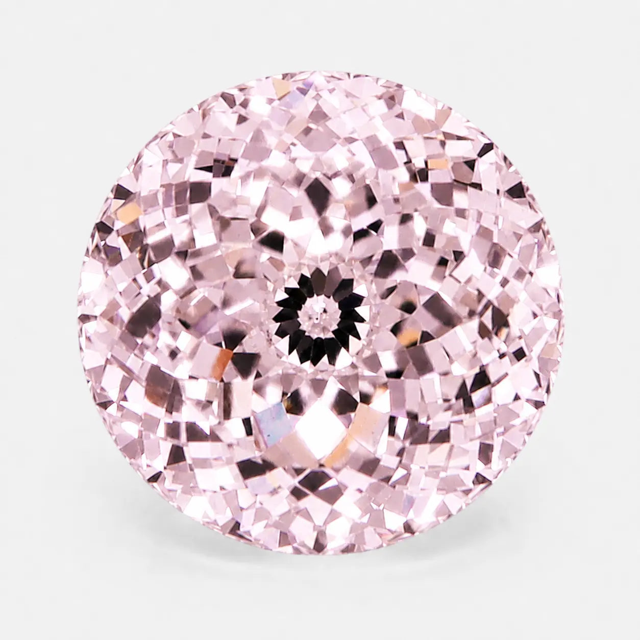 round portuguese diamond in a blush pink tone